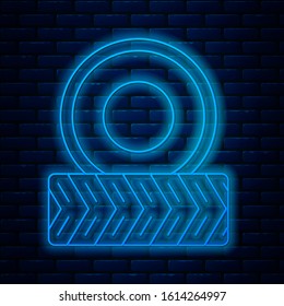 Glowing neon line Car wheel icon isolated on brick wall background.  Vector Illustration