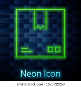Glowing neon line Cardboard box with traffic symbol icon isolated on brick wall background. Box, package, parcel. Delivery, transportation and shipping. Vector Illustration