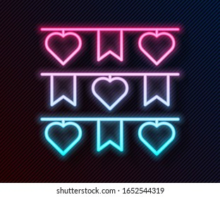 Glowing neon line Carnival garland with flags icon isolated on black background. Party pennants for birthday celebration, festival decoration.  Vector Illustration