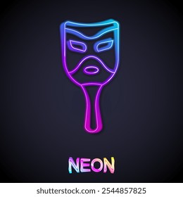 Icono de máscara de carnaval de línea de neón brillante aislado sobre fondo negro. Mascarada máscara de fiesta.  Vector