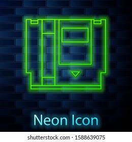 Glowing neon line Cartridge for retro game console icon isolated on brick wall background. TV Game cartridge.  Vector Illustration