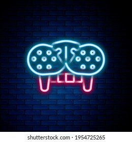 Glowing neon line Cat tooth icon isolated on brick wall background. Colorful outline concept. Vector