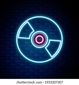 Glowing neon line CD or DVD disk icon isolated on brick wall background. Compact disc sign. Colorful outline concept. Vector