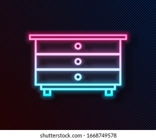 Glowing neon line Chest of drawers icon isolated on black background.  Vector Illustration