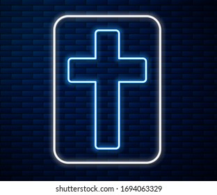 Glowing neon line Christian cross icon isolated on brick wall background. Church cross.  Vector Illustration
