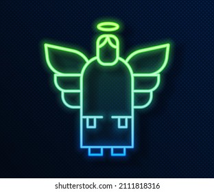Glowing neon line Christmas angel icon isolated on blue background.  Vector