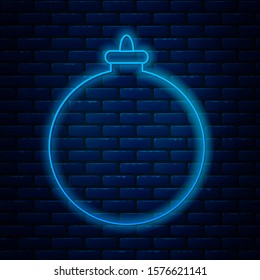 Glowing neon line Christmas ball icon isolated on brick wall background. Merry Christmas and Happy New Year.  Vector Illustration