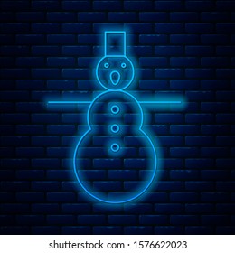 Glowing neon line Christmas snowman icon isolated on brick wall background. Merry Christmas and Happy New Year.  Vector Illustration