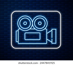 Glowing neon line Cinema camera icon isolated on brick wall background. Video camera. Movie sign. Film projector.  Vector Illustration