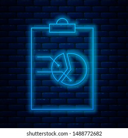Glowing neon line Clipboard with graph chart icon isolated on brick wall background. Report text file icon. Accounting sign. Audit, analysis, planning.  Vector Illustration