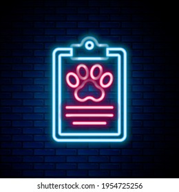 Glowing neon line Clipboard with medical clinical record pet icon isolated on brick wall background. Health insurance form. Medical check marks report. Colorful outline concept. Vector