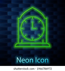 Glowing neon line Clock icon isolated on brick wall background. Time symbol.  Vector