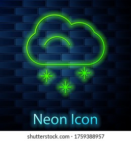 Glowing neon line Cloud with snow icon isolated on brick wall background. Cloud with snowflakes. Single weather icon. Snowing sign. Vector Illustration
