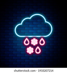 Glowing neon line Cloud with snow and rain icon isolated on brick wall background. Weather icon. Colorful outline concept. Vector