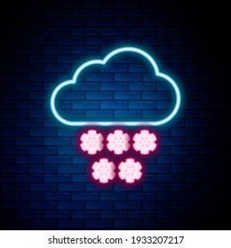 Glowing neon line Cloud with snow icon isolated on brick wall background. Cloud with snowflakes. Single weather icon. Snowing sign. Colorful outline concept. Vector