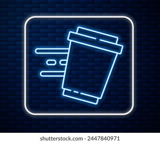 Glowing neon line Coffee cup to go icon isolated on brick wall background.  Vector