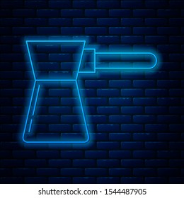 Glowing neon line Coffee turk icon isolated on brick wall background.  Vector Illustration