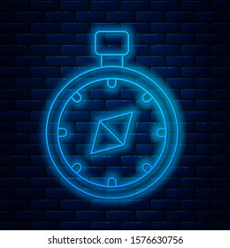 Glowing neon line Compass icon isolated on brick wall background. Windrose navigation symbol. Wind rose sign.  Vector Illustration