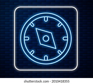 Glowing neon line Compass icon isolated on brick wall background. Windrose navigation symbol. Wind rose sign.  Vector