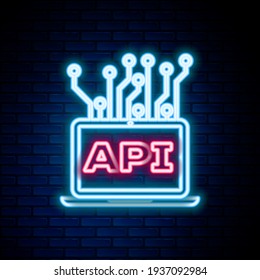Glowing neon line Computer api interface icon isolated on brick wall background. Application programming interface API technology. Software integration. Colorful outline concept. Vector