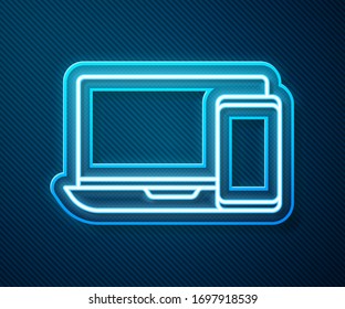Glowing neon line Computer monitor and mobile phone icon isolated on blue background. Earnings in the Internet, marketing.  Vector Illustration