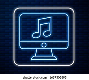 Glowing neon line Computer with music note symbol on screen icon isolated on brick wall background.  Vector Illustration