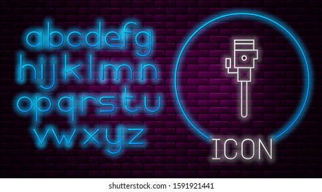 Glowing neon line Construction jackhammer icon isolated on brick wall background. Neon light alphabet. Vector Illustration