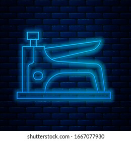 Glowing neon line Construction stapler icon isolated on brick wall background. Working tool.  Vector Illustration