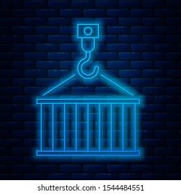 Glowing neon line Container on crane icon isolated on brick wall background. Crane lifts a container with cargo.  Vector Illustration