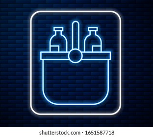 Glowing neon line Cooler bag and water icon isolated on brick wall background. Portable freezer bag. Handheld refrigerator.  Vector Illustration