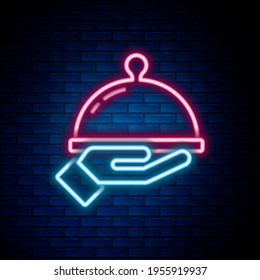 Glowing neon line Covered with a tray of food icon isolated on brick wall background. Tray and lid sign. Restaurant cloche with lid. Colorful outline concept. Vector