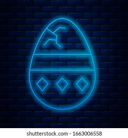 Glowing neon line Cracked egg icon isolated on brick wall background. Happy Easter.  Vector Illustration
