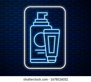Glowing neon line Cream or lotion cosmetic tube icon isolated on brick wall background. Body care products for men.  Vector Illustration