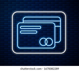 Glowing neon line Credit card icon isolated on brick wall background. Online payment. Cash withdrawal. Financial operations. Shopping sign.  Vector Illustration