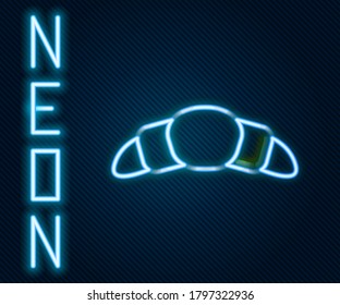 Glowing neon line Croissant icon isolated on black background. Colorful outline concept. Vector Illustration