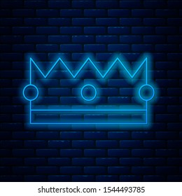 Glowing neon line Crown icon isolated on brick wall background.  Vector Illustration