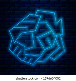Glowing neon line Crumpled paper ball icon isolated on brick wall background.  Vector Illustration