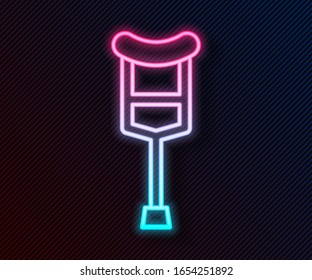 Glowing neon line Crutch or crutches icon isolated on black background. Equipment for rehabilitation of people with diseases of musculoskeletal system.  Vector Illustration