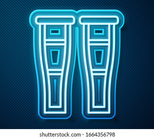 Glowing neon line Crutch or crutches icon isolated on blue background. Equipment for rehabilitation of people with diseases of musculoskeletal system.  Vector Illustration