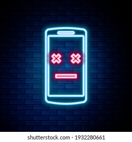 Glowing neon line Dead mobile icon isolated on brick wall background. Deceased digital device emoji symbol. Corpse smartphone showing facial emotion. Colorful outline concept. Vector