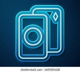 Glowing neon line Deck of playing cards icon isolated on blue background. Casino gambling.  Vector Illustration