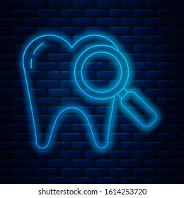 Glowing neon line Dental search icon isolated on brick wall background. Tooth symbol for dentistry clinic or dentist medical center.  Vector Illustration