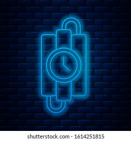 Glowing neon line Detonate dynamite bomb stick and timer clock icon isolated on brick wall background. Time bomb - explosion danger concept.  Vector Illustration