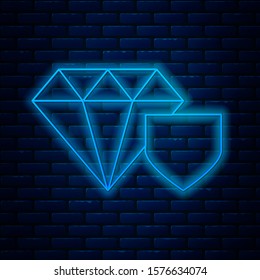 Glowing neon line Diamond with shield icon isolated on brick wall background. Jewelry insurance concept. Security, safety, protection, protect concept.  Vector Illustration