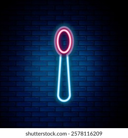 Glowing neon line Disposable plastic spoon icon isolated on brick wall background. Colorful outline concept. Vector