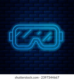 Glowing neon line Diving mask icon isolated on brick wall background. Extreme sport. Diving underwater equipment.  Vector