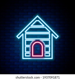 Glowing neon line Dog house icon isolated on brick wall background. Dog kennel. Colorful outline concept. Vector