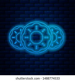 Glowing neon line Donut with sweet glaze icon isolated on brick wall background.  Vector Illustration