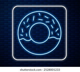 Línea de neón brillante Donut con icono de esmalte dulce aislado en fondo de pared de ladrillo.  Vector