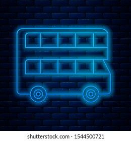 Glowing neon line Double decker bus icon isolated on brick wall background. London classic passenger bus. Public transportation symbol.  Vector Illustration